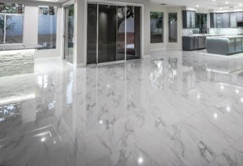 Bright and modern Valencia living room featuring newly installed polished marble tiles by expert contractors.