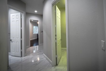 Marble tile flooring extending into the hallway of Eddie K. Hardaway’s Valencia home.